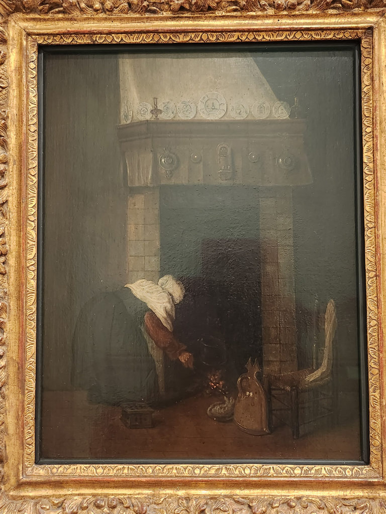 (15) Femme à la cheminée. Huile sur panneau 36 x 27,5cm. Amsterdam Rijksmuseum. Vue de dos la femme attise le feu. Au premier plan un chauffe-pieds et un couvre-feu en faïence. Réutilisation d’un panneau plus ancien avec un portrait.